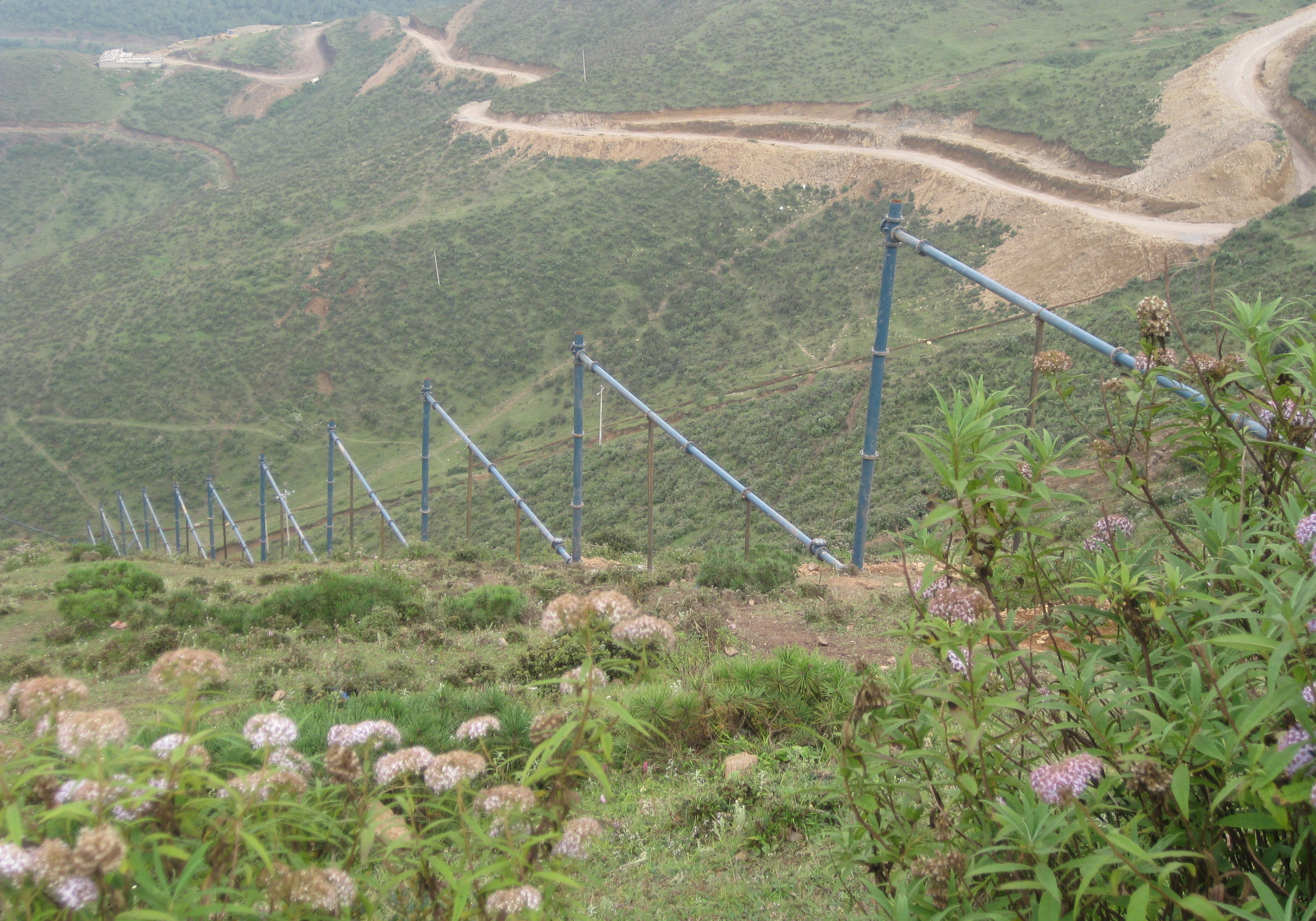 P2_Jing Wang_Baozi Pu gravity pipeline descending from 2200 meters_China...